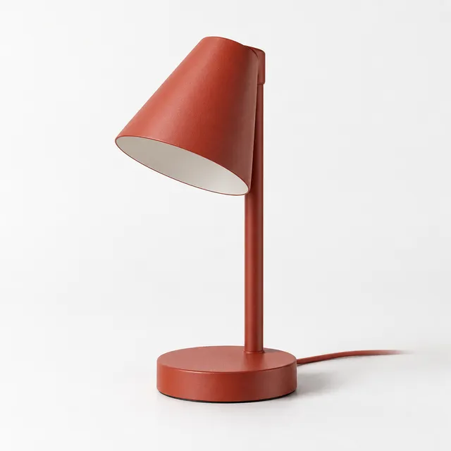 Vermilion Compact lamp with a short angled stem and round base.